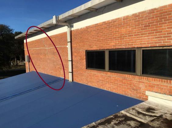 Auditorium east wall stair step cracking in concrete beam and brick façade. Submitted photo