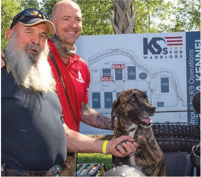 Jack Wells, left, alongside one of the K9s For Warriors veterans and his companion dog. Photos by Jim Dohms