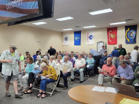 The chambers of the Nassau County Board of County Commissioners was overflowing with people asking the commission to reject a settlement offer from Riverstone Properties. However, despite the pleas, BOCC accepted the offer. Photo by Julia Robets/News-Leader