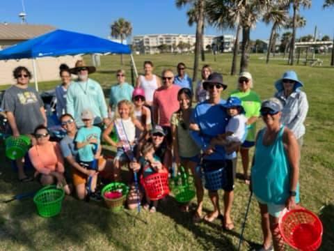 Only a portion of the more than 50 volunteers who showed up to help clean the beach on Saturday are pictured here. Submitted photo