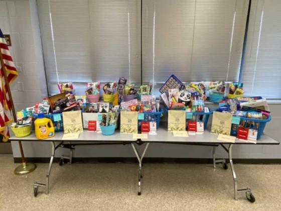NESPA members brought enough gifts to fill the gift baskets to overflowing. Submitted photo