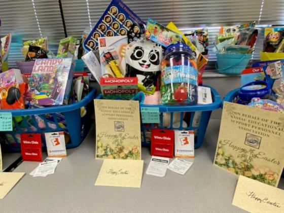 NESPA members brought enough gifts to fill the gift baskets to overflowing. Submitted photo