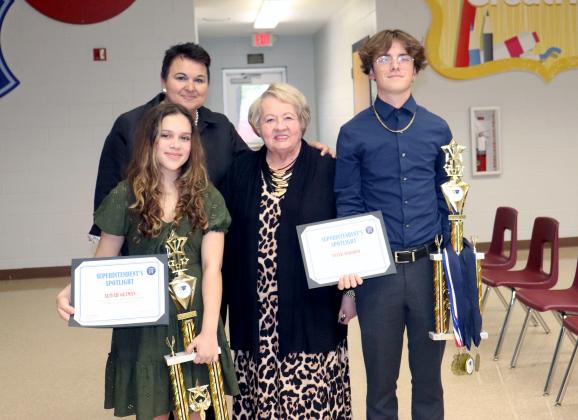 Yulee High School seniors Tyler Osborne and Aliyah Guzman placed first in the Florida Civics and Debate Initiative in Orlando April 1. Teacher Janice Van Delinder and Superintendent Kathy Burns join them. The Nassau County School Board met at Hilliard Elementary School Thursday night. Photo by Kathie Sciullo/Nassau County Record