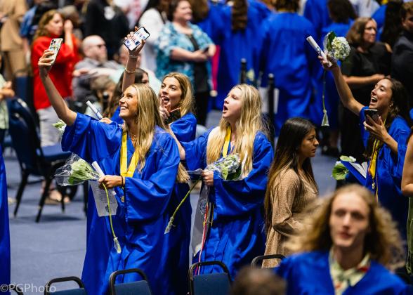 Officially graduated, Fernandina Beach High School grads celebrate with a picture to remember the moment. Penny Glackin/Holly Dorman/News-Leader