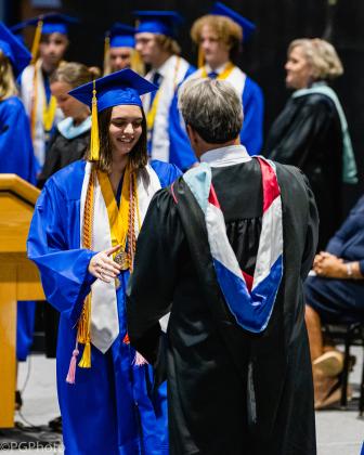 Fernandina Beach High School valedictorian Emmie Athavale walks across the stage to receive her diploma. Penny Glackin/News-Leader