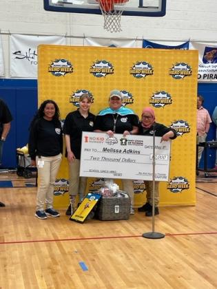 Fernandina Beach Middle School cafeteria manager Melissa Adkins accepts the 2023 School Lunch Hero award at a surprise ceremony held Monday afternoon. Submitted photo
