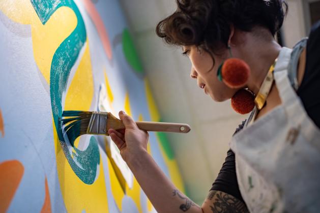 Local artist Lauren Hom partnered with Visit Florida and The Florida Department of Citrus to paint this mural welcoming visitors to Florida. Submitted photo