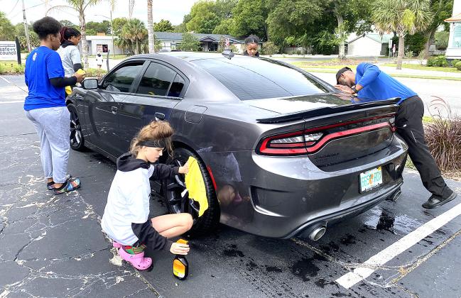 Nassau Ballerz are washing cars and raising money. Photos by Beth Jones/News-Leader