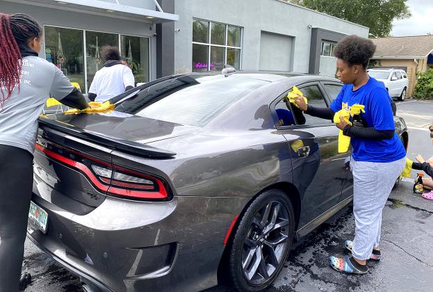 Nassau Ballerz are washing cars and raising money. Photos by Beth Jones/News-Leader