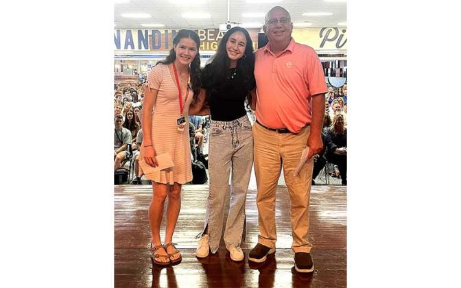 Fernandina Beach Men’s Golf Association Scholarship Trust Fund President Louis Greak is pictured with scholarship recipients Elizabeth Hernandez, left, and Frances Gauna, center. Submitted photo