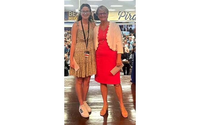 2023 Kraft Tennis Partners scholarshp winner Anna Curley accepts her $2,000 scholarship from scholarship committee member Liz McCall at the Fernandina Beach High School awards ceremony. Submitted photo