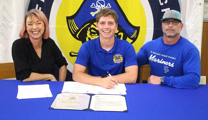 Jamieson Keith, Brooks Rohe and Andre Lucas signed national letters of intent to play their respective sport in college. Keith is a baseball player at Fernandina Beach High School, and Rohe and Lucas played football for the Pirates. They are pictured April 27 with friends, family and coaches at the spring signing day in the media center. Photo by Beth Jones/News-Leader
