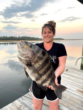 Chelsea McFadden, above right, is now a seasoned lady angler after catching this large black drum. She is also married to seasoned local charter fishing captain Billy McFadden.  Special photo