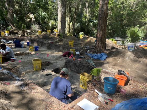 University of North Florida archeology students scoop dirt one spoonful at a time to search for artifacts. With the extra dirt, sifters rake through it searching for anything of note. Photos by Holly Dorman/News-Leader