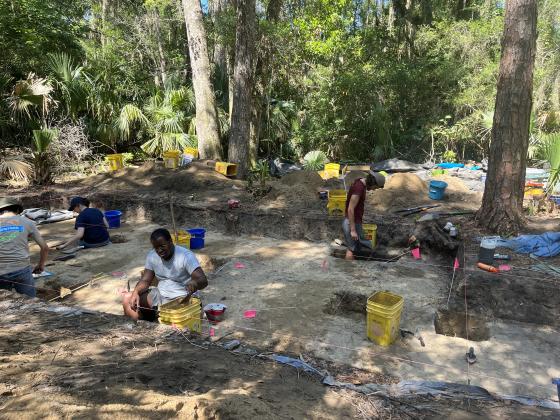 University of North Florida archeology students scoop dirt one spoonful at a time to search for artifacts. With the extra dirt, sifters rake through it searching for anything of note. Photos by Holly Dorman/News-Leader