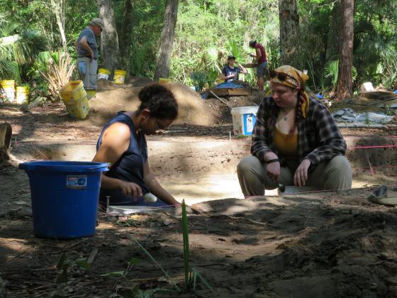 University of North Florida archeology students scoop dirt one spoonful at a time to search for artifacts. With the extra dirt, sifters rake through it searching for anything of note. Photos by Holly Dorman/News-Leader