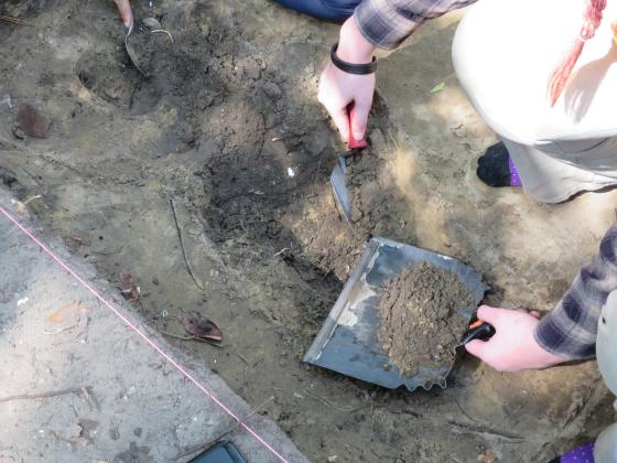 University of North Florida archeology students scoop dirt one spoonful at a time to search for artifacts. With the extra dirt, sifters rake through it searching for anything of note. Photos by Holly Dorman/News-Leader