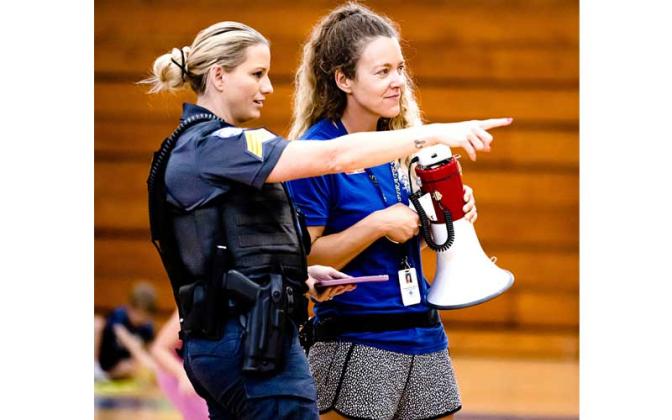 Fernandina Beach police officers stopped by the Fernandina Beach High School gym Tuesday and played dodgeball with the children attending the P.E. Camp this summer. Photos by Penny Glackin/Special 