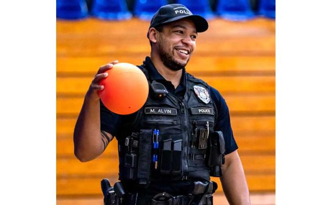 Fernandina Beach police officers stopped by the Fernandina Beach High School gym Tuesday and played dodgeball with the children attending the P.E. Camp this summer. Photos by Penny Glackin/Special