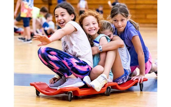 Fernandina Beach police officers stopped by the Fernandina Beach High School gym Tuesday and played dodgeball with the children attending the P.E. Camp this summer. Photos by Penny Glackin/Special