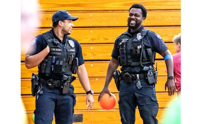 Fernandina Beach police officers stopped by the Fernandina Beach High School gym Tuesday and played dodgeball with the children attending the P.E. Camp this summer. Photos by Penny Glackin/Special