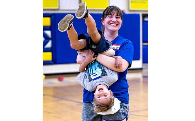 Fernandina Beach police officers stopped by the Fernandina Beach High School gym Tuesday and played dodgeball with the children attending the P.E. Camp this summer. Photos by Penny Glackin/Special