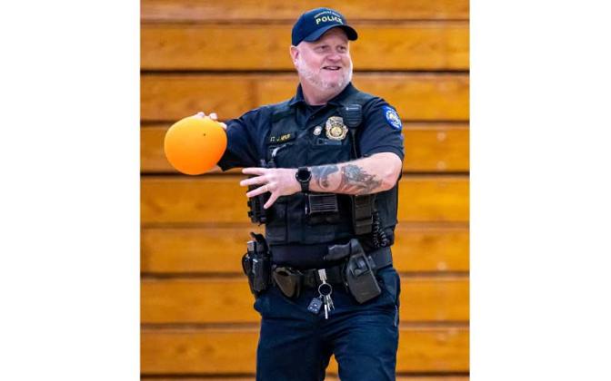 Fernandina Beach police officers stopped by the Fernandina Beach High School gym Tuesday and played dodgeball with the children attending the P.E. Camp this summer. Photos by Penny Glackin/Special