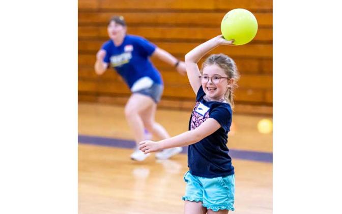 Fernandina Beach police officers stopped by the Fernandina Beach High School gym Tuesday and played dodgeball with the children attending the P.E. Camp this summer. Photos by Penny Glackin/Special