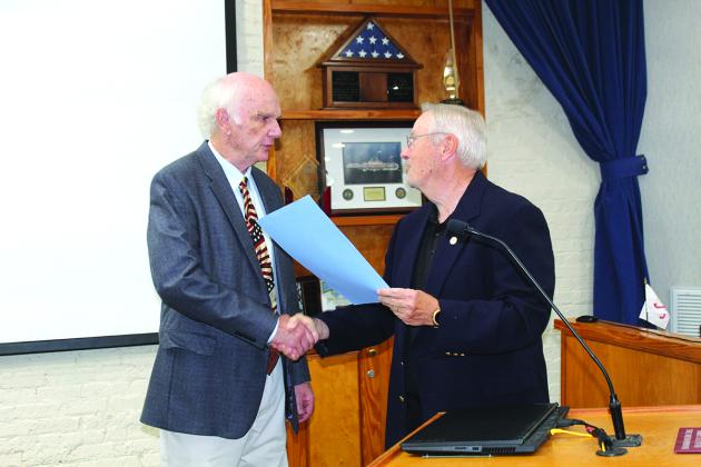At the Feb. 15, 2022, Fernandina Beach City Commission meeting, (former) Mayor Mike Lednovich, right, read a proclamation recognizing former Mayor Ran Sapp for his extensive civic service and unwavering commitment to the city. Photo by Julia Roberts/News-Leader