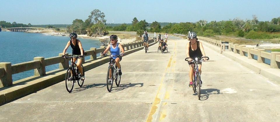  Cyclists come onto Amelia Island over the George Crady Bridge. As more people ride on the island, riders need more bike lanes and other safety precautions, a task force created to study the issue said. Submitted photo