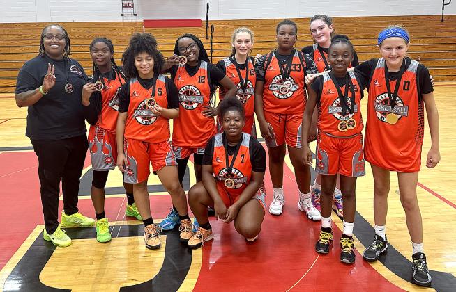 The seventh-grade championship teams included the Lady Warriors from Brunswick, Ga. Submitted photo