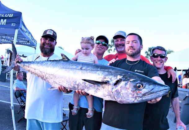 Last year, team Good Problem weighed in the largest kingfish at 51.3 pounds for first-place honors and a check for $7,500. Pictured are, from left, Brad Ecklof, Ben Langley and daughter Sadi, Taj Delong, boat captain James Powell and Joe Lassiter. Photo by Terry Lacoss/Special