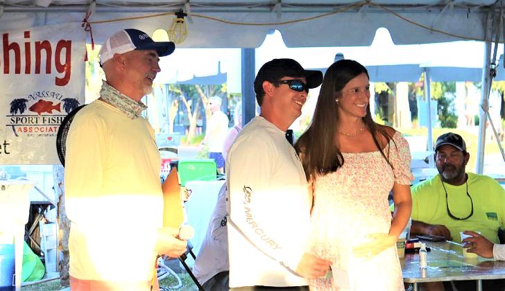 Nassau Sport Fishing Association President Shawn Arnold is pictured with top lady angler Flossy Ross and her husband, Spencer Ross, above left, at the awards ceremony last year. Photo by Terry Lacoss/Special
