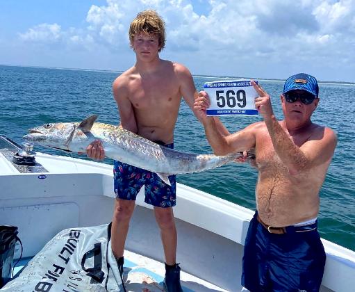 David Mapson, Neal Hammons, Tristan Mapson and Justin Hammons, from left, are pictured with their first-place kingfish, weighing an impressive 47.7 pounds. Team Taking the Bait took home the top prize of $10,000. Photo by Terry Lacoss