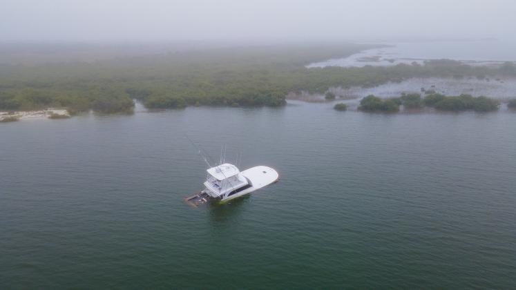 A 54-foot, $1.2 million boat sinks after a collision that killed an endangered North Atlantic right whale calf and severely injured its mother in 2021 near St. Augustine. Photos courtesy Florida Fish and Wildlife Conservation Commission