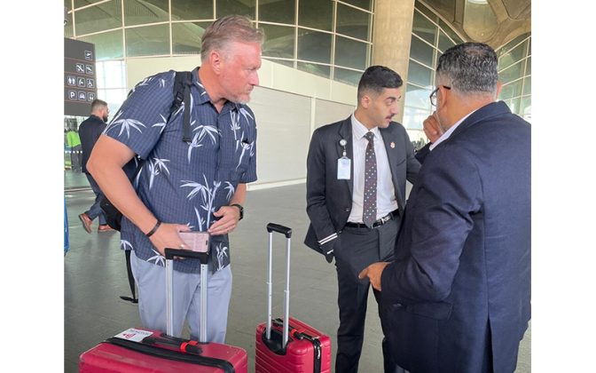 Pastor Zach Terry speaks with officials as he tries to get his group home from Israel. Submitted photo