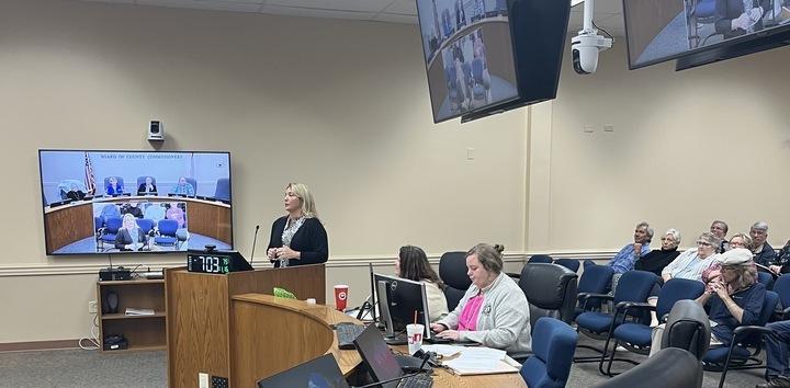 Bobbie Walker speaks to the Conditional Use and Variance board on Nov. 16, and some family members can be seen behind her. Photo by Sean Rosenthal/News-Leader