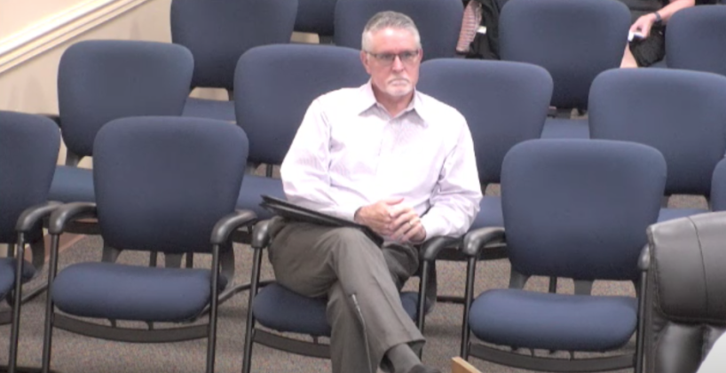 Agent Doug Smith listens to public comment in opposition of his company’s application for a conditional use permit for the sale of beer and wine at a site at the southeast corner of Meadowfield Bluffs Road and SR 200. Photo by Sean Rosenthal/News-Leader
