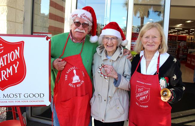 John Hartrich, left, Miriam Dudiak, right, and Dudiak’s 96-year-old mother, Helen, man the Winn-Dixie in Fernandina Beach on Wednesday afternoon.  Photo by Beth Jones/News-Leader