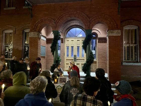 Carlene McDuffie, left, and Zen Carver, right, read the names of those lost to homelessness at the first CHNassau vigil to honor National Homeless Persons’ Remembrance Day. Photo by Sean Rosenthal