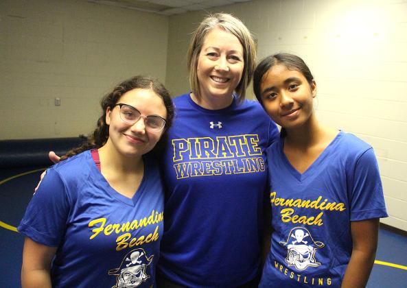 FBHS head girls wrestling coach Erin Mahoney is flanked by team members Audrey Miller, left, and Anjana Sermadevi. Photo by Beth Jones/News-Leader