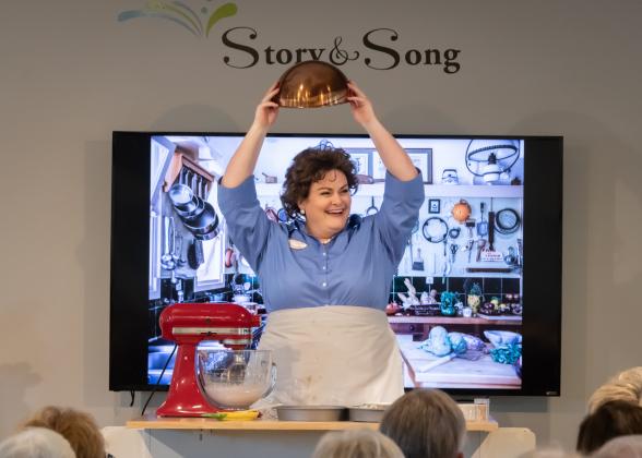 Robyn Marie Lamp bakes a chocolate cake onstage singing Julia Child in Lee Hoiby’s opera, “Bon Appétit!” with Amelia Island Opera. Photo by Lea Lewin Gallardo