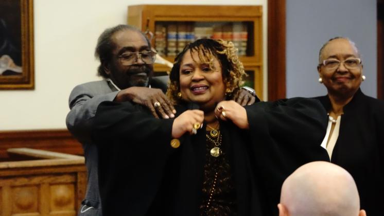 Parents Veronica and DiWell Wallace had the honor of robing their daughter, Deirdre Wallace, as the first full-time magistrate to serve the Nassau County Courts at a ceremony on Wednesday. Images Courtesy 4th Judicial Circuit