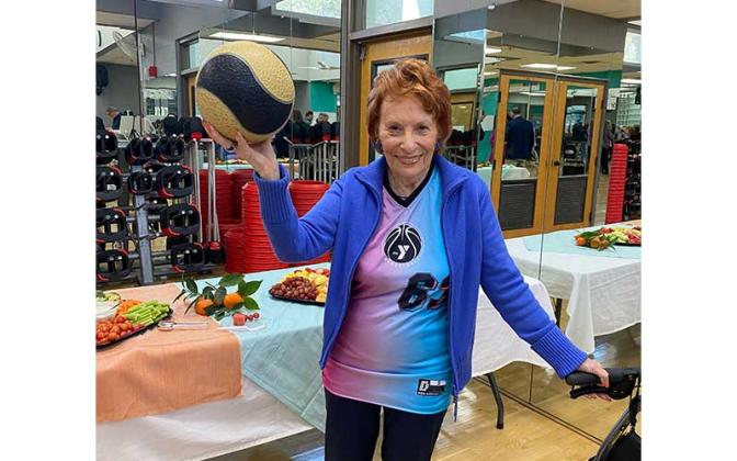 Betty Berkman donned her new jersey after the dedication of the newly named David Berkman Gymnasium. Photo by Tracy Dishman