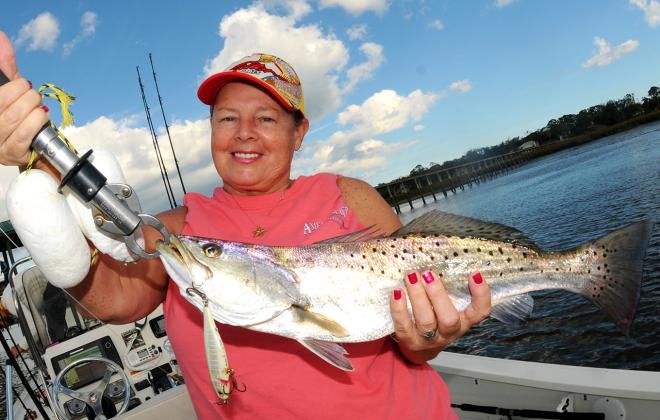 Slow trolling a hard plastic plug produced this nice winter sea trout for Glenda Crosby. Photo by Terry Lacoss