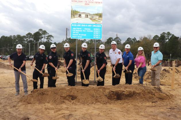 From left, Public Works Director Doug Podiak; Eng. Jason Seepersad; Lt. Paul Buchman; Eng. Blake Partin; FF Colby Beverly; Capt. Adam Salzburg; Fire Chief Brady Rigdon; Frank Anderson, Construction Manager, ACON Construction; Chasidy Grubbs, President of A Plus Construction and Steve Lazar, Architect, VRL Architects. Photos by Sabrina Robertson/Nassau County Board of County Commissioners