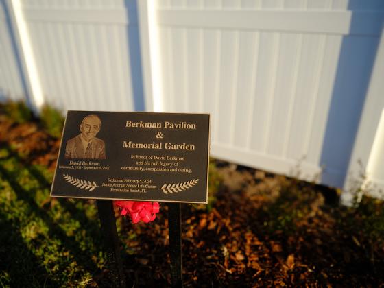 A bronze sign in memory of David Berkman welcomes visitors at both entrances. Photo by Rikky Sanders, Rikky Sanders Photography