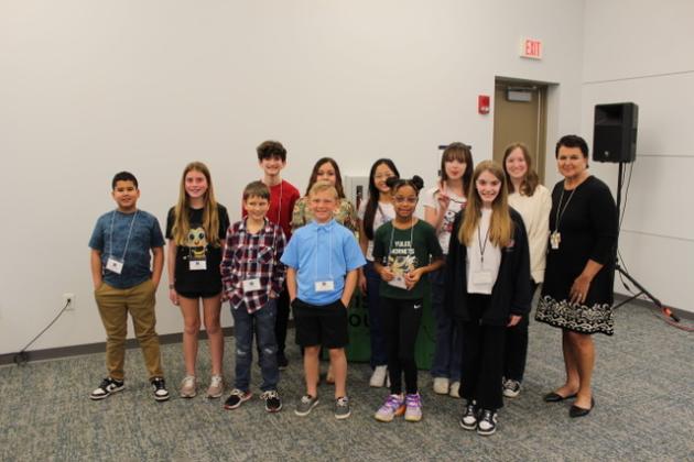 Spelling bee contestants, back row from left, Isaac Wiley, Kennedi Brayton, Nickolas Garnett, Brittanie Galarza-Vergara, winner Cathy Le, Ava Grandey, Elle Adams and Superintendent of Nassau County School Kathy Burns; front row from left, Charles King, Nolan Wood, Darolyn Ford and Lacey Solomon. Submitted