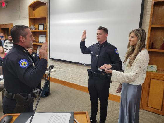 Chief Tambasco swore in newly hired Police Officer Robert Dickson. Photo by Julia Roberts/News-Leader