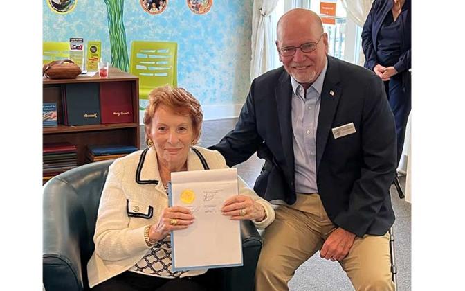 A proclamation was presented to Betty Berkman and her family by board Chairman John Martin.